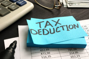 post it with the words tax deduction