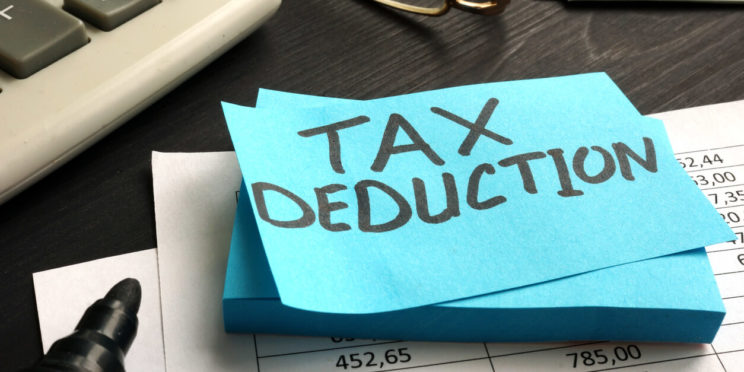 post it with the words tax deduction